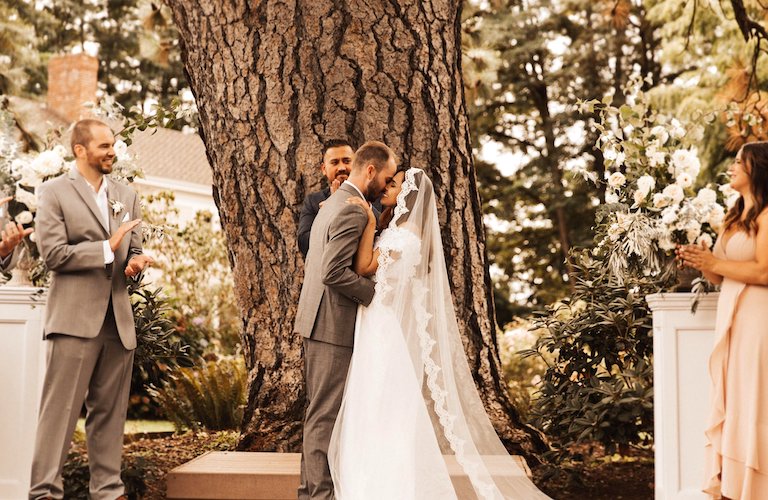 bride and groom under Ponderosa Pine