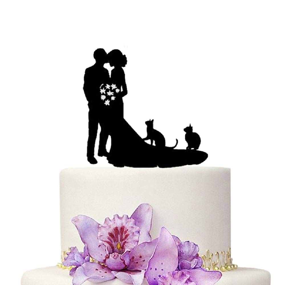 wedding cake topper with 2 people and 2 cats