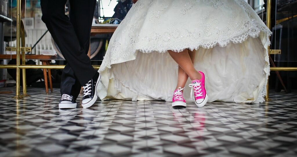 Bride and groom in tennis shoes