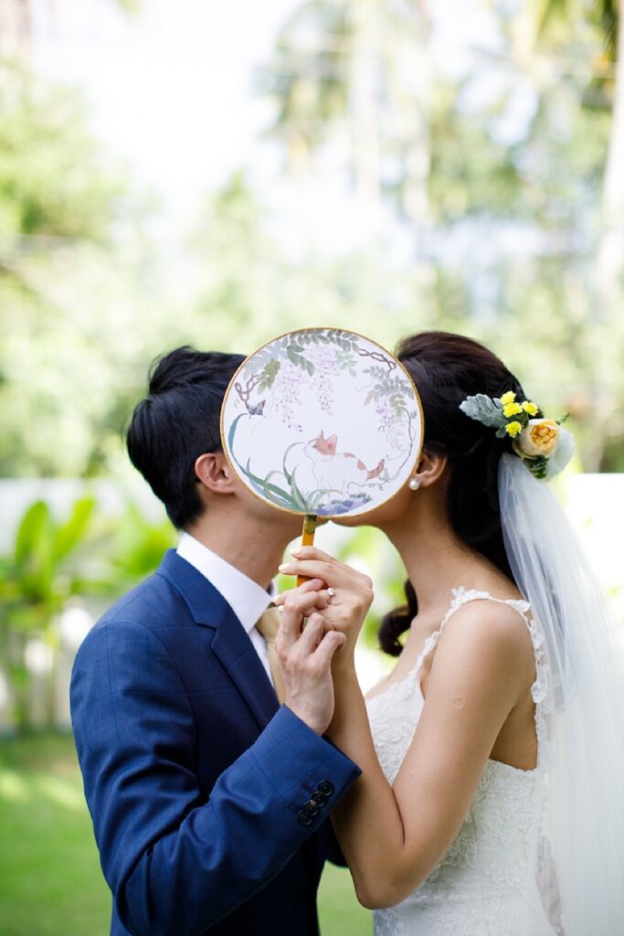 a wedding fan with the image of a cat