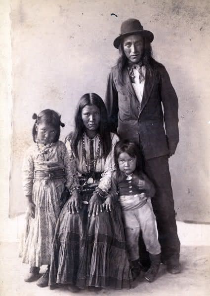 Gouyen, famous Apache warrior woman, sits in the middle