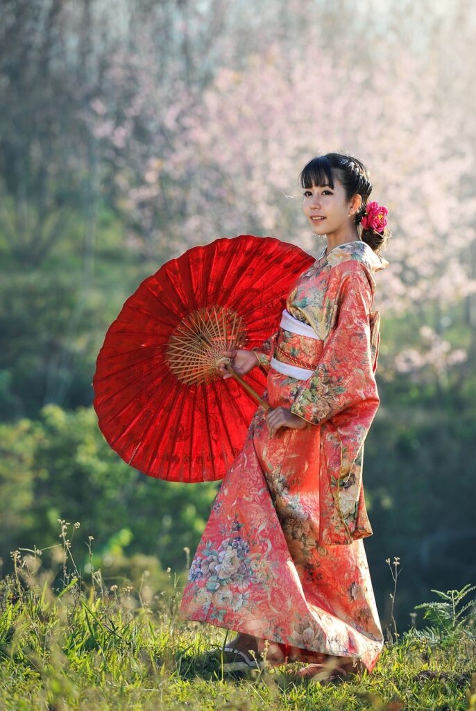 Japanese geisha with red parasol