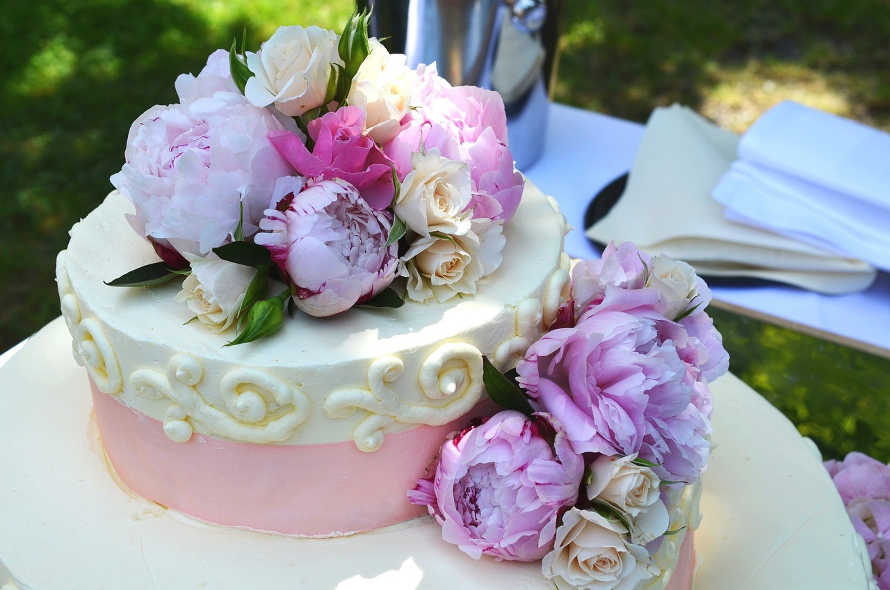 wedding cake decorated with lavender and white flowers