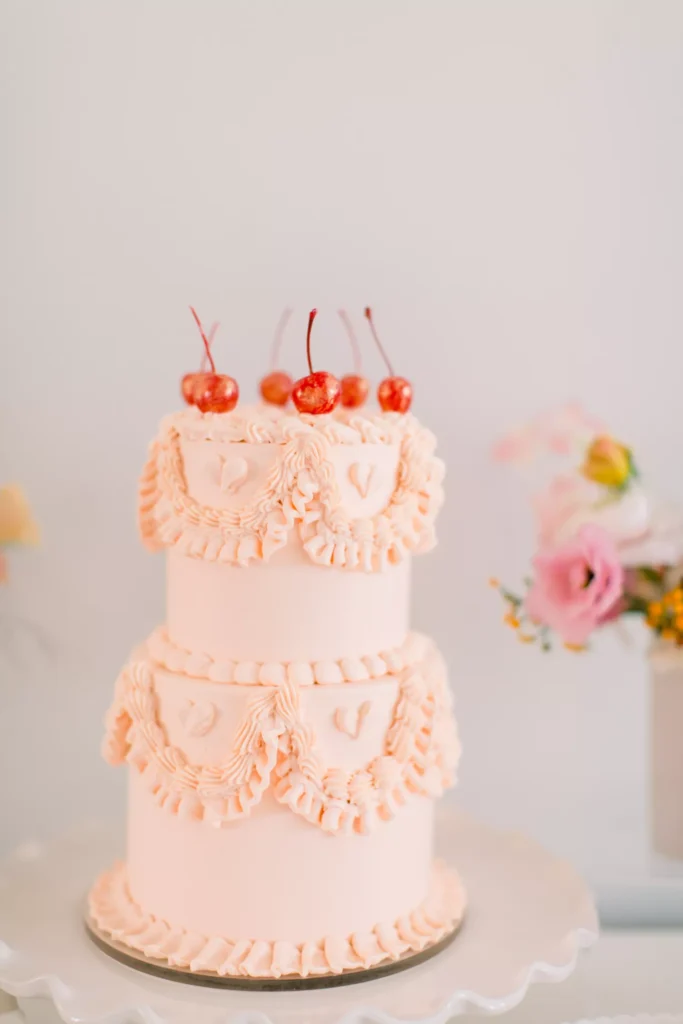 Brides.com pink wedding cake with vintage Lambeth piping