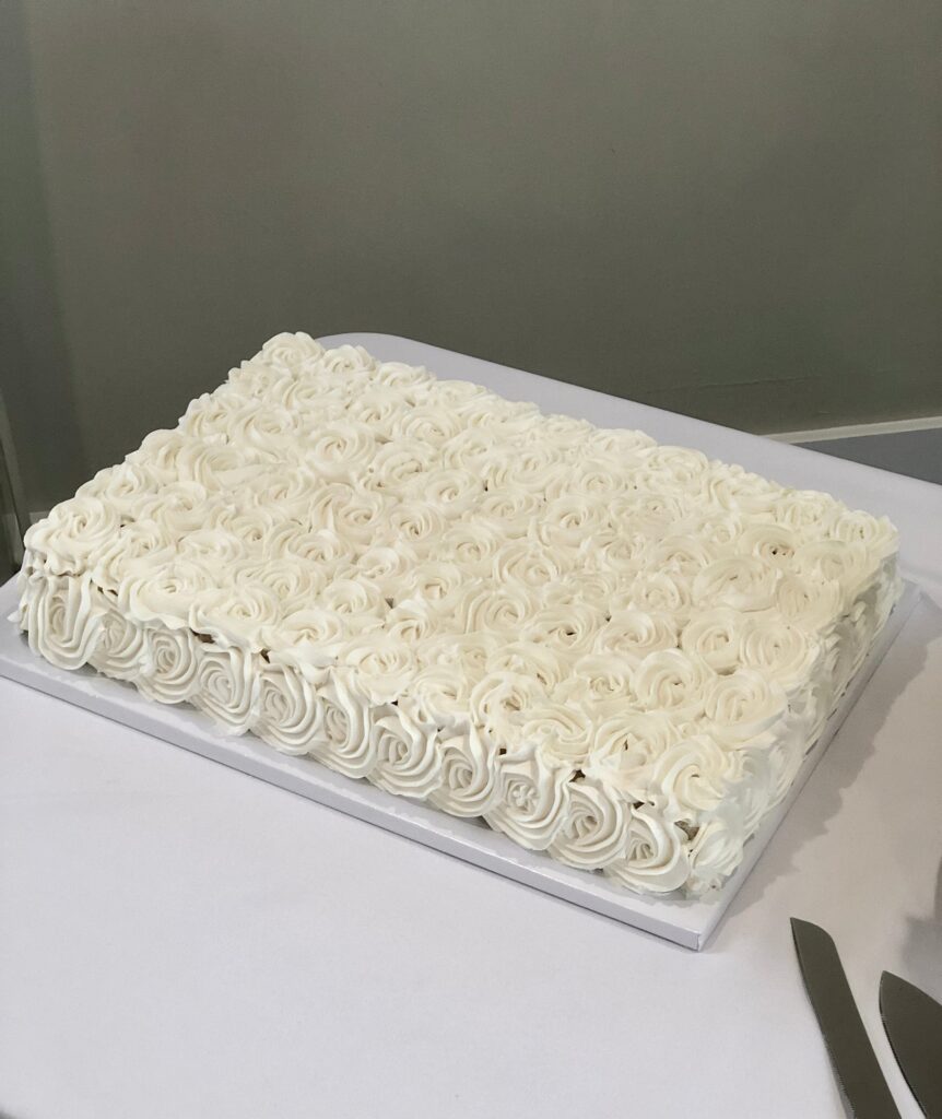 white sheet wedding cake Harbor Cakes photo