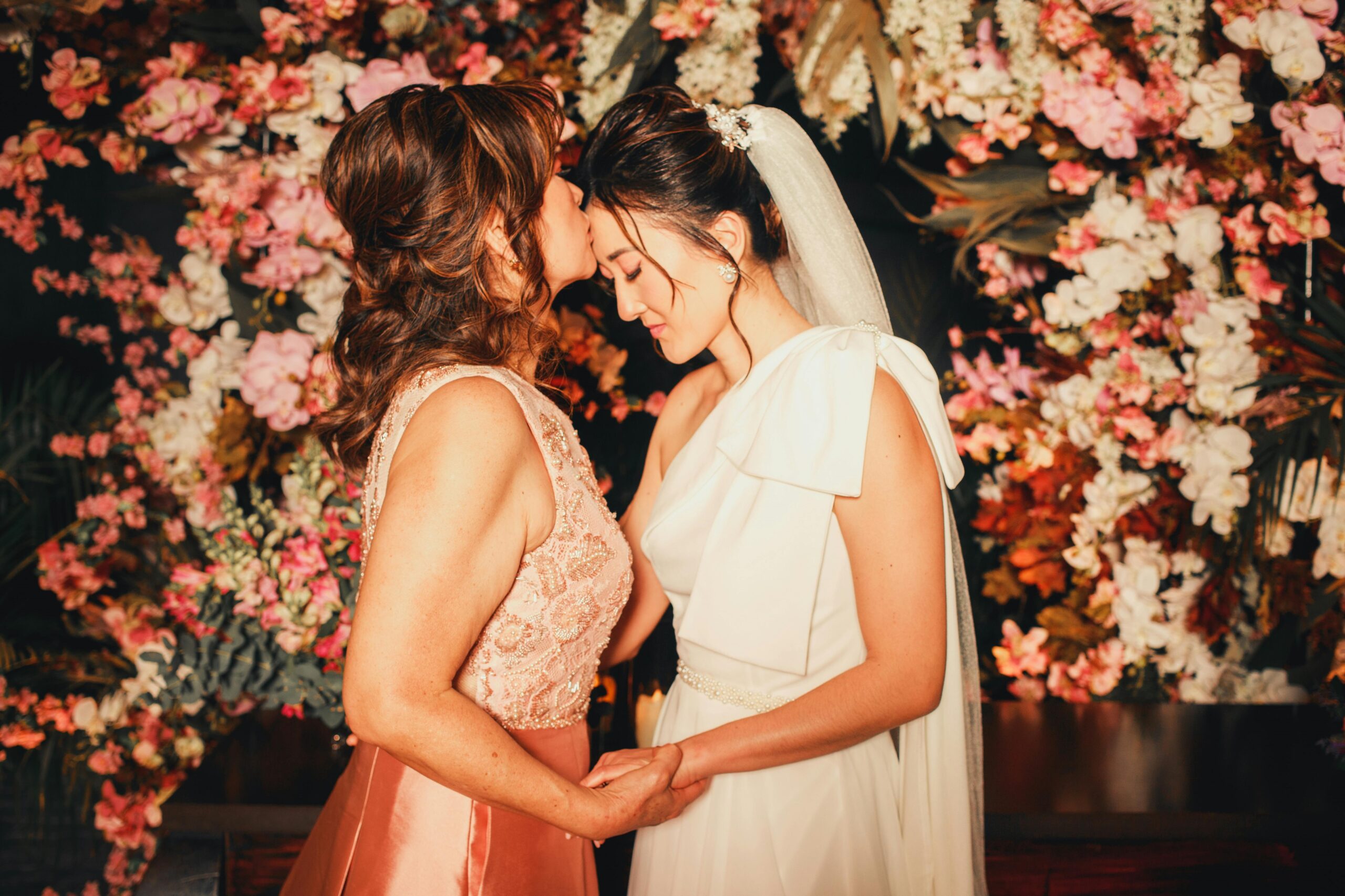 Mother kisses her daughter the bride on the forehead Pexels