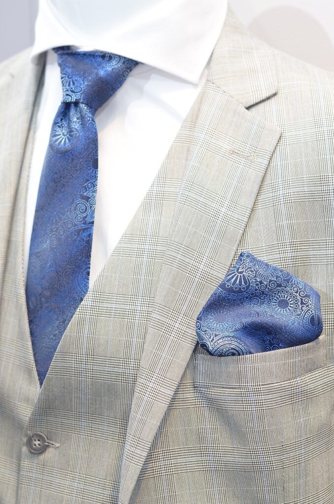 man in a suit and blue tie with pocket square PXBY