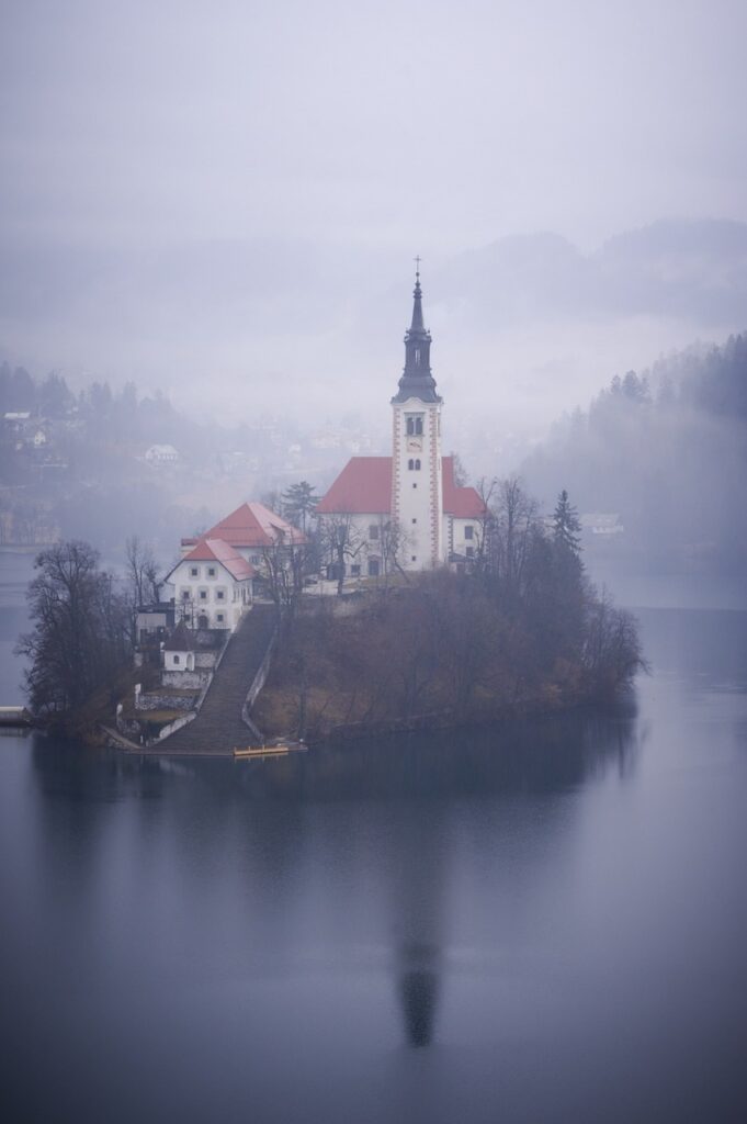 church on an island in a lake Pixabay