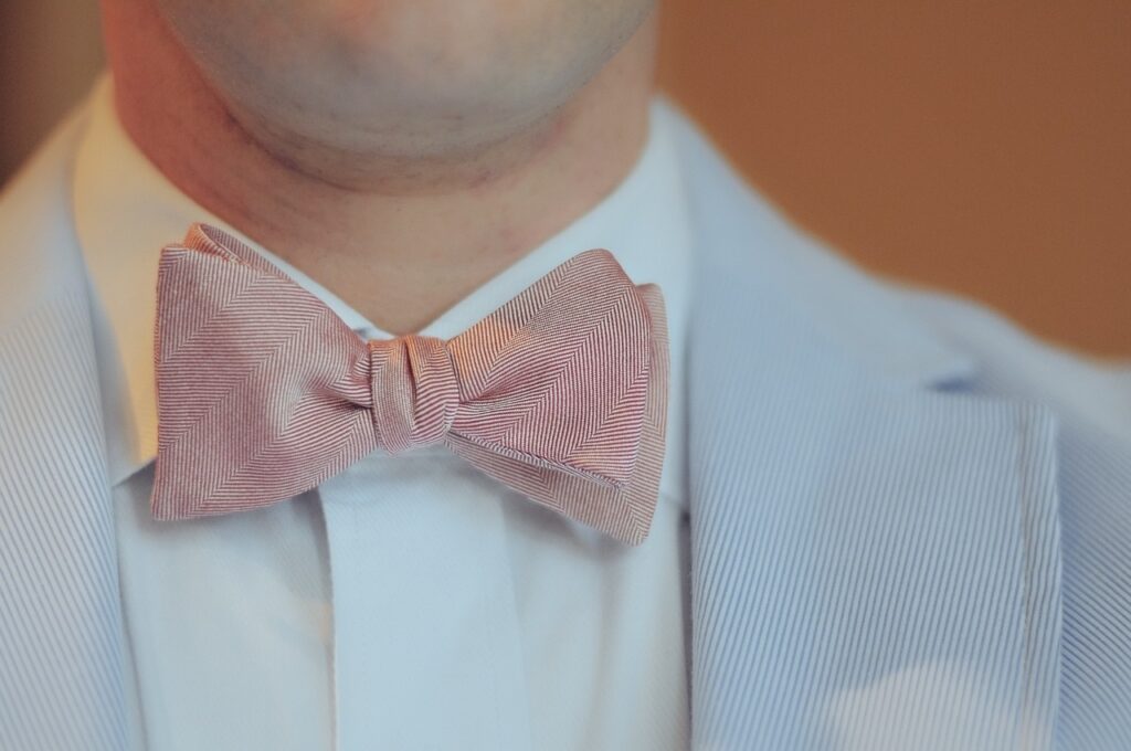 man in peach bow tie Pixabay