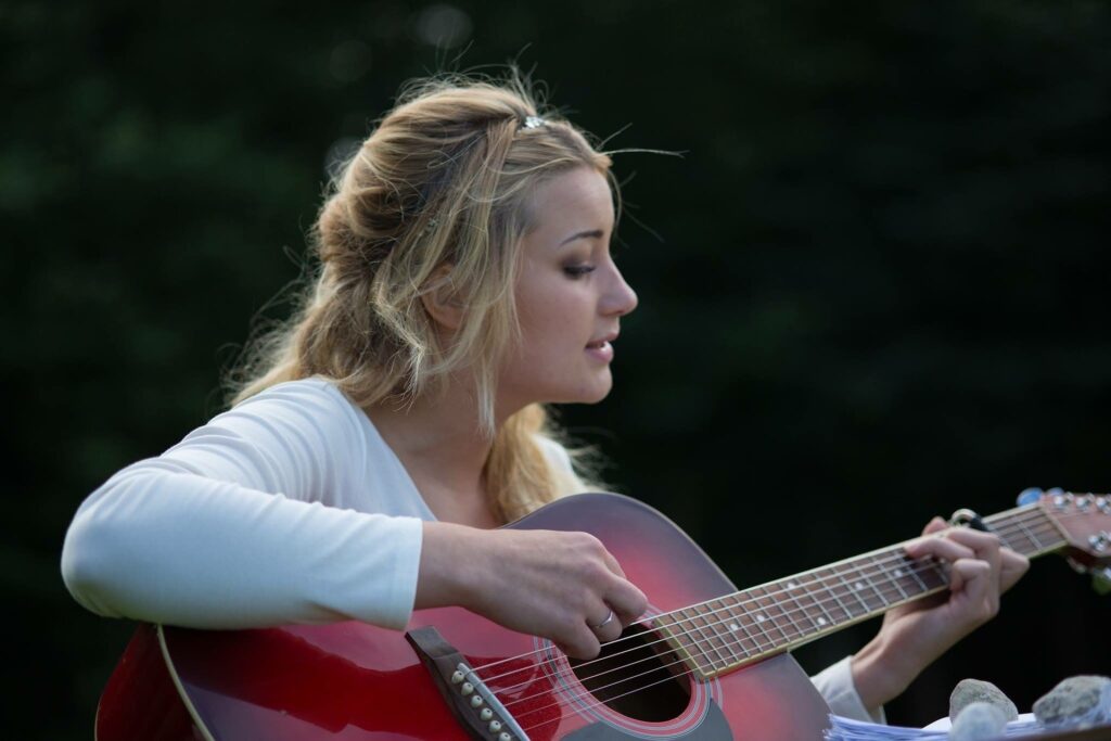 woman playing guitar