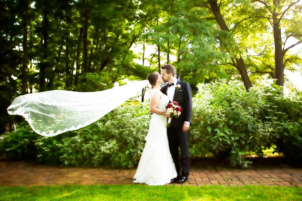 Newlyweds kissing after wedding in Oregon City