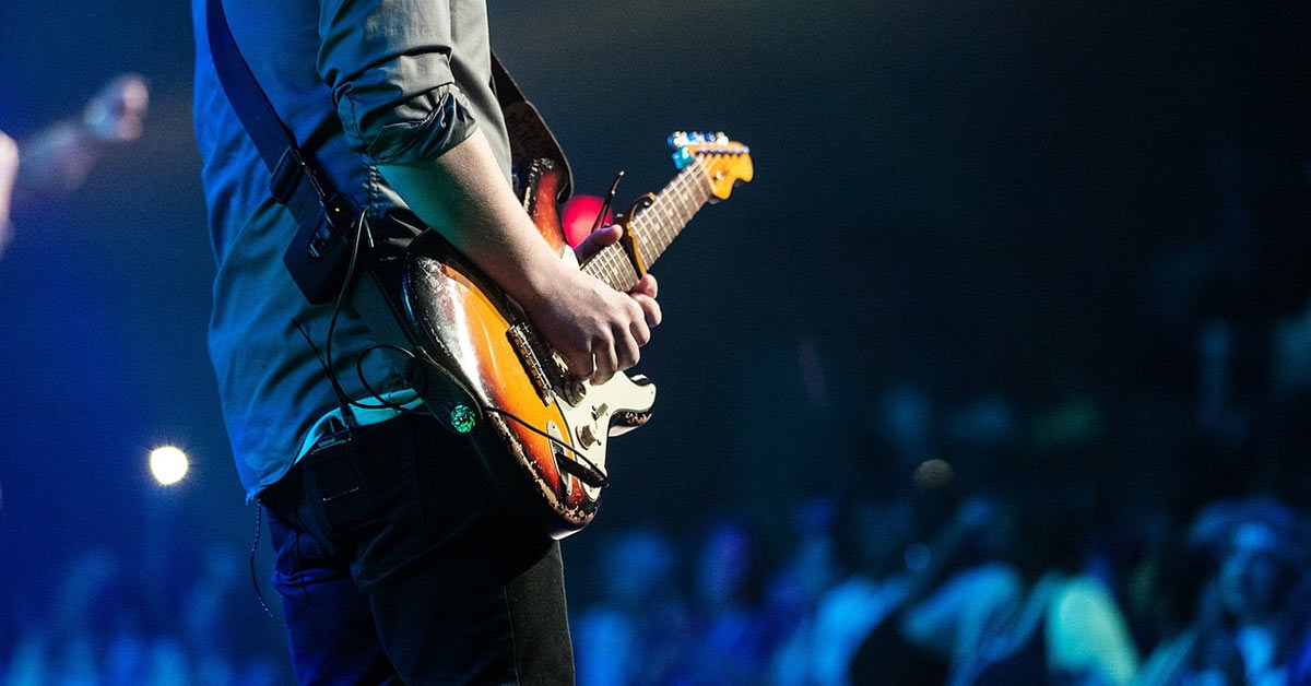 A man plays a guitar