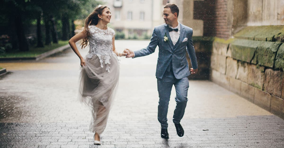 newlyweds in rain