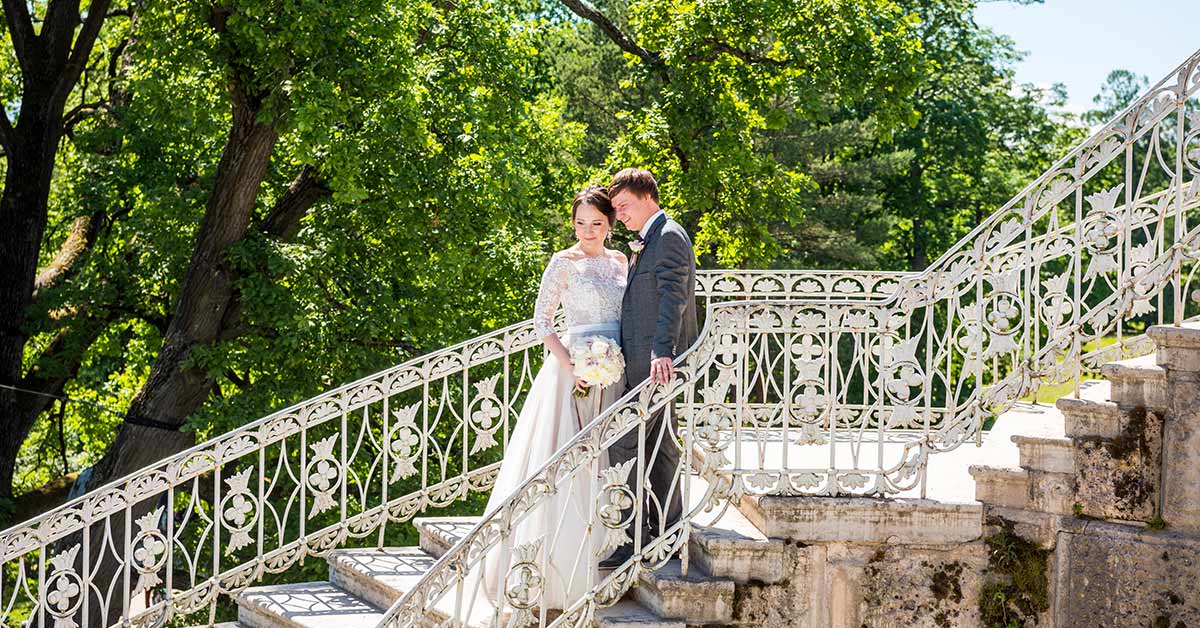 newly weds on historic stair case